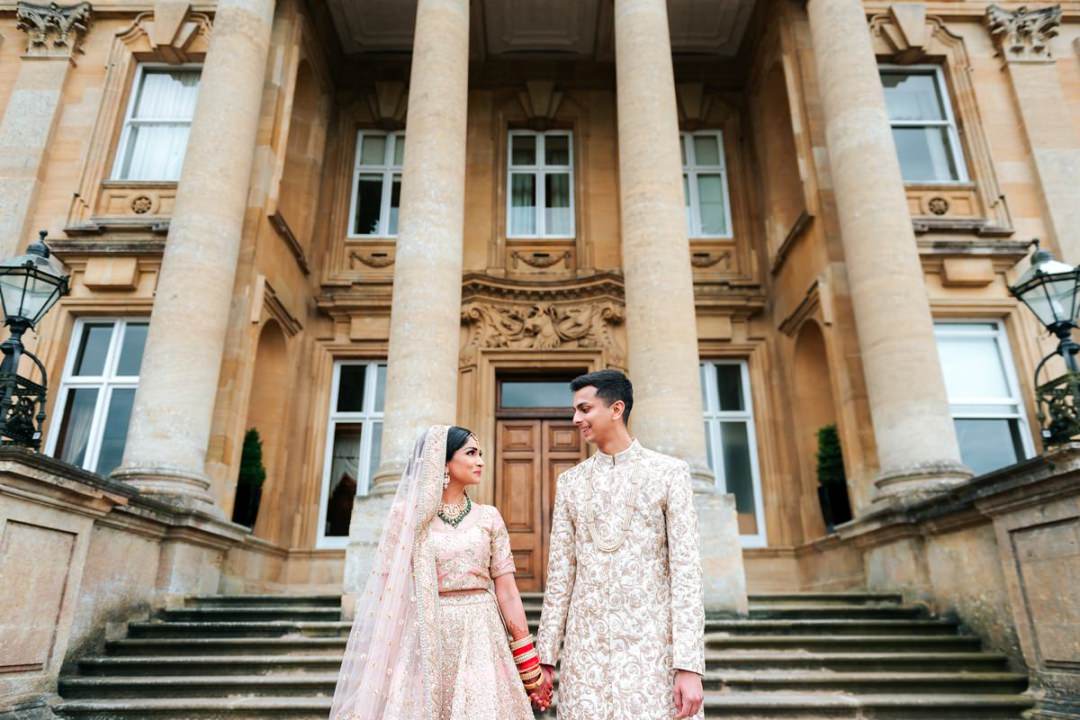 Hindu Wedding couple outside Heythrop Park Resort