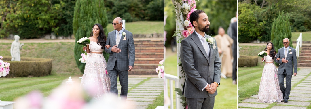 Bride making her entrance outside wedding at Rowhill Grange 