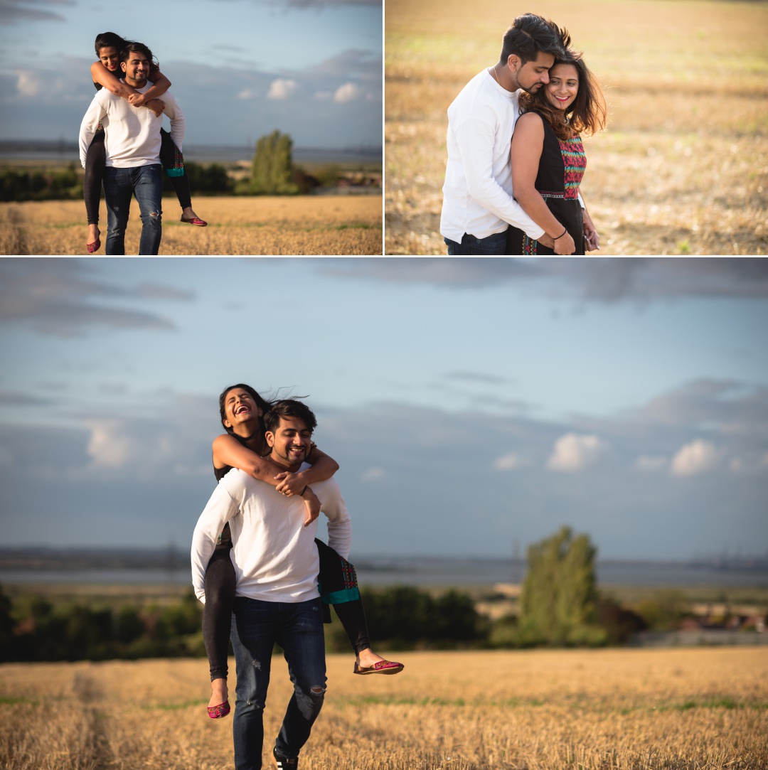 couple having fun on prewedding shoot in wheat field 